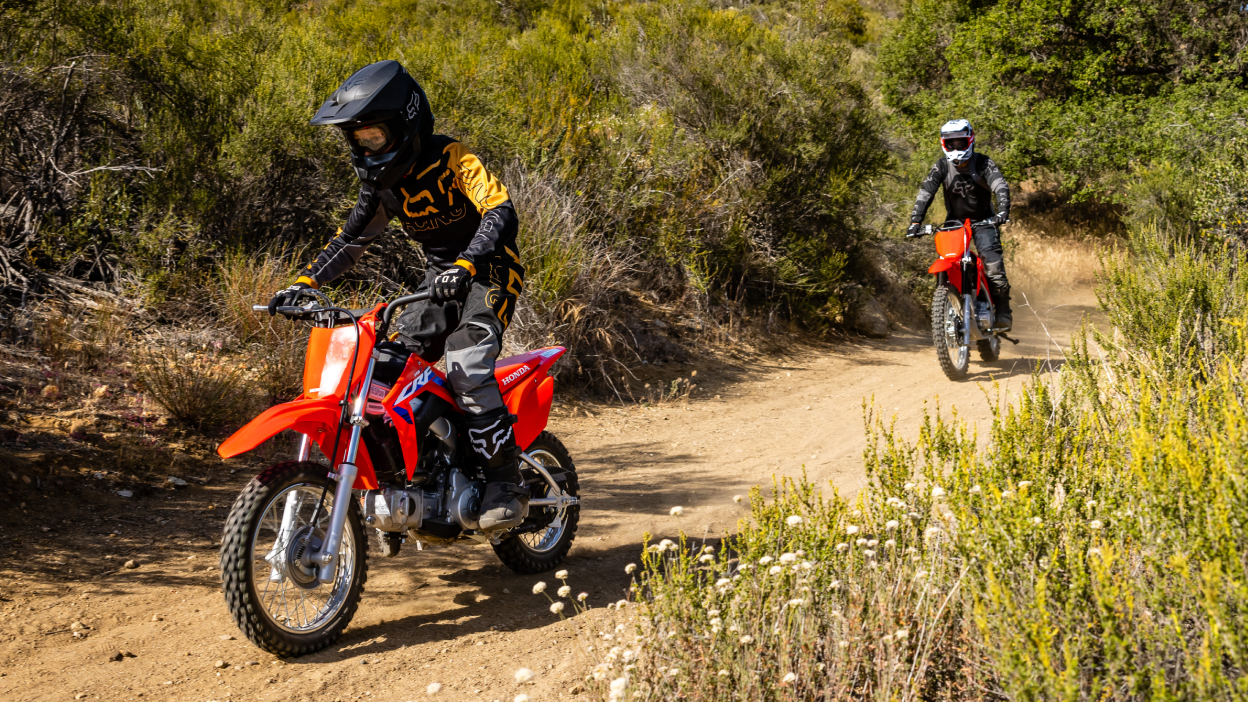 Two riders on Honda CRF Trail dirt bikes