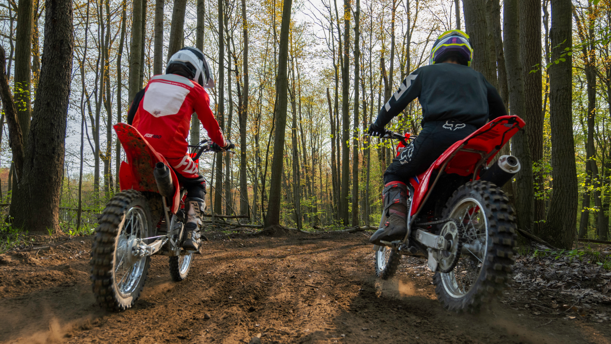 Two riders on Honda CRF Trail dirt bikes