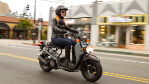 A rider on a Honda Ruckus in the city