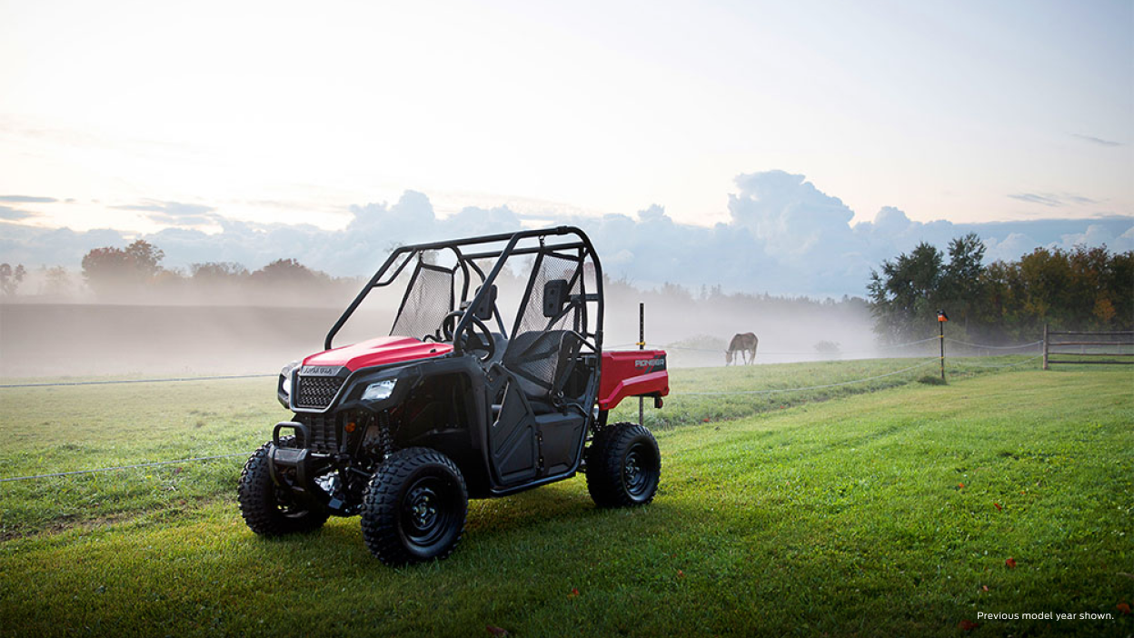 A Pioneer 520 beside a grassy field